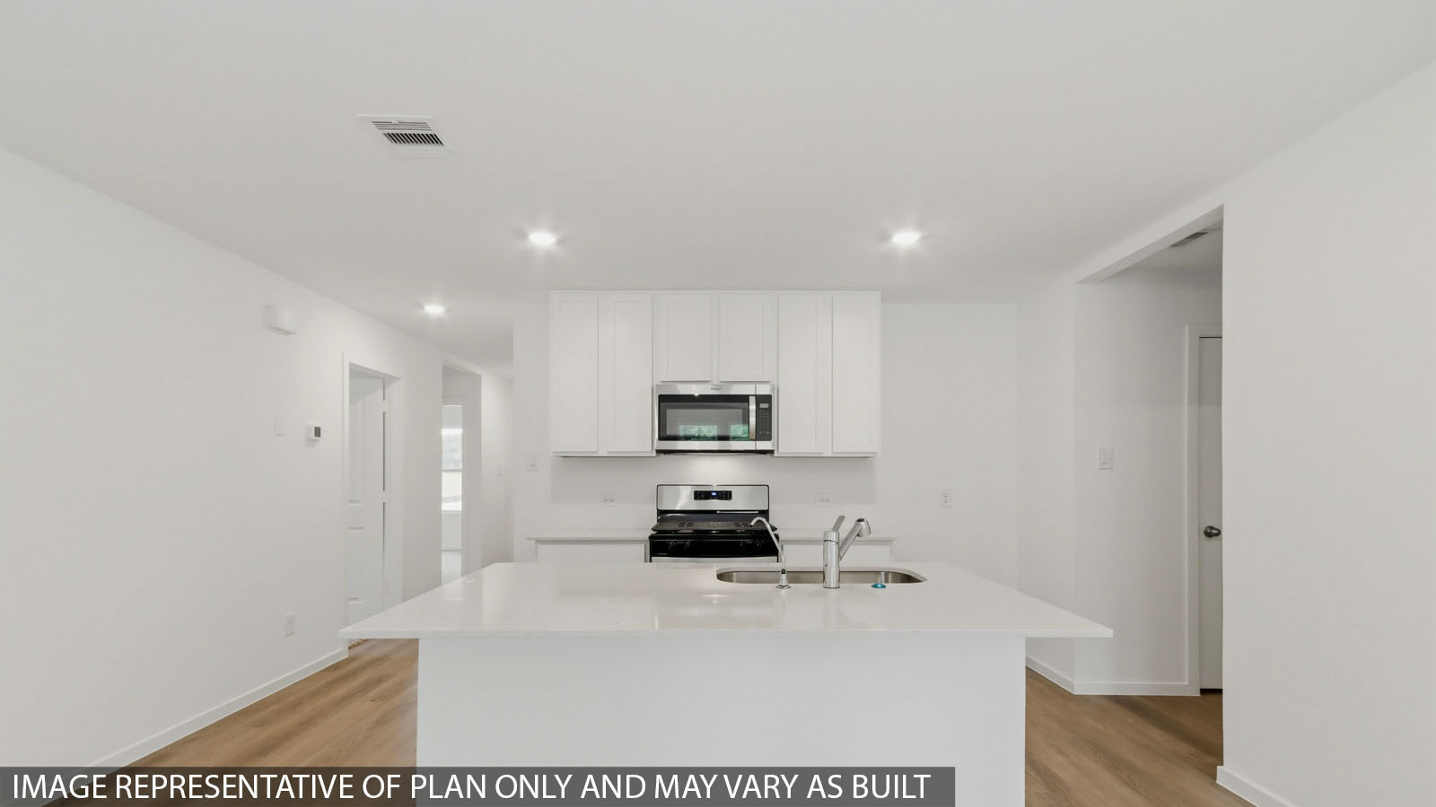 Open concept living, dining, and kitchen area
