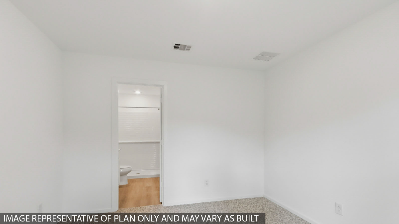 Primary bedroom with carpet flooring