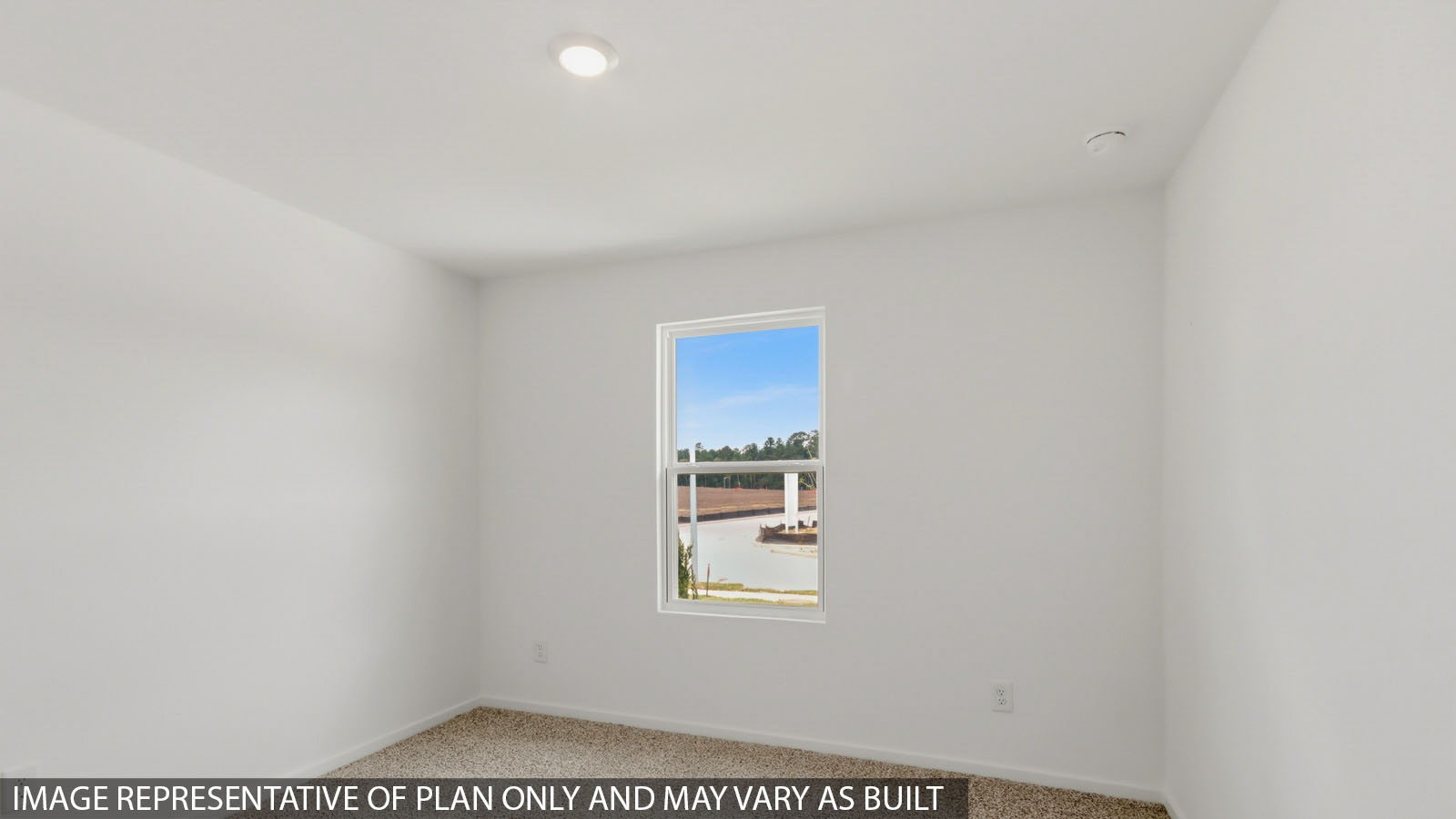 Secondary bedroom with carpet flooring