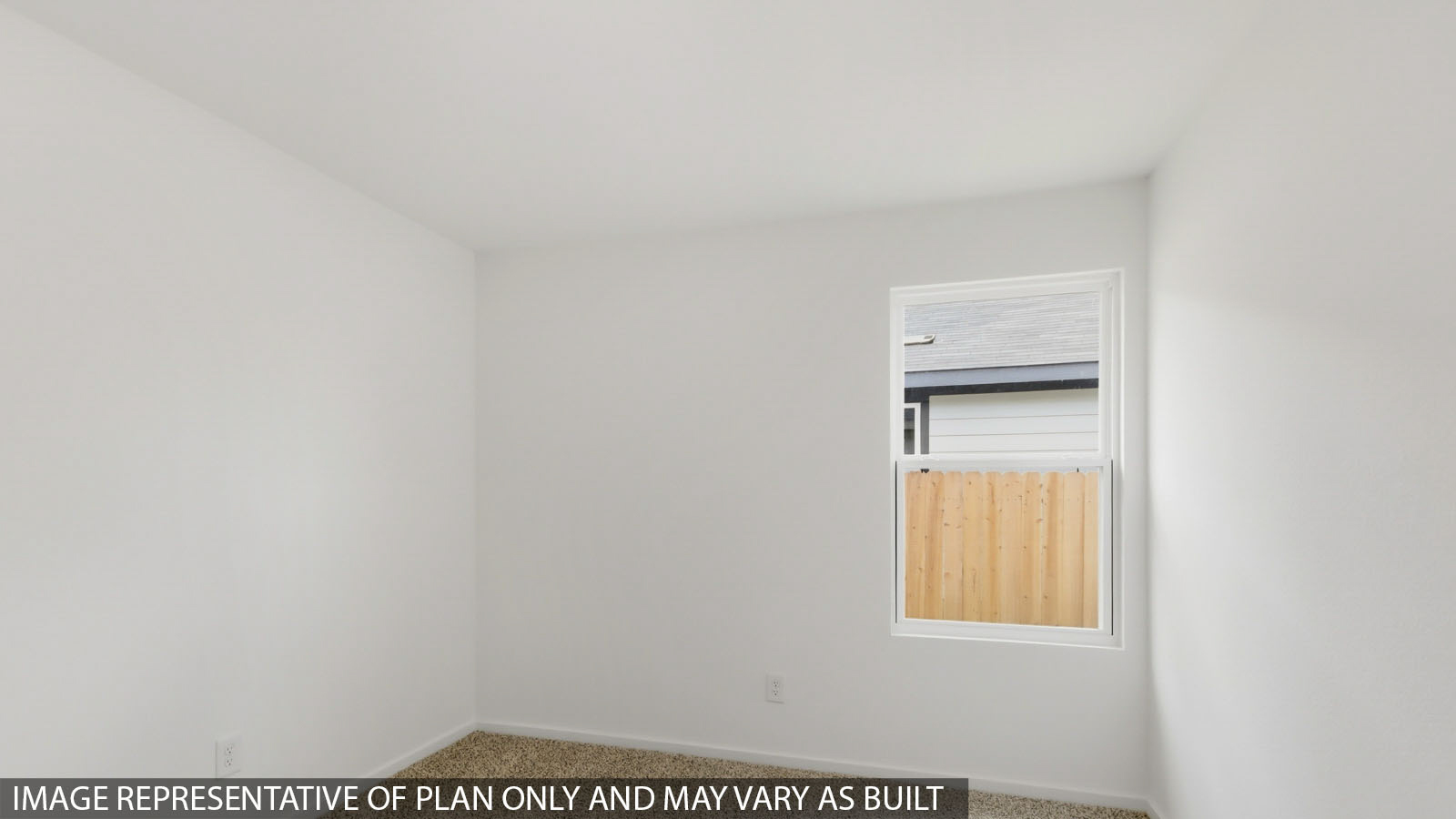 Secondary bedroom with carpet flooring