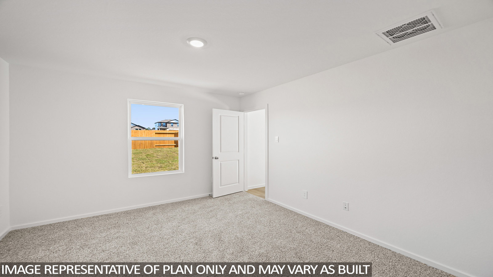Primary bedroom with carpet flooring