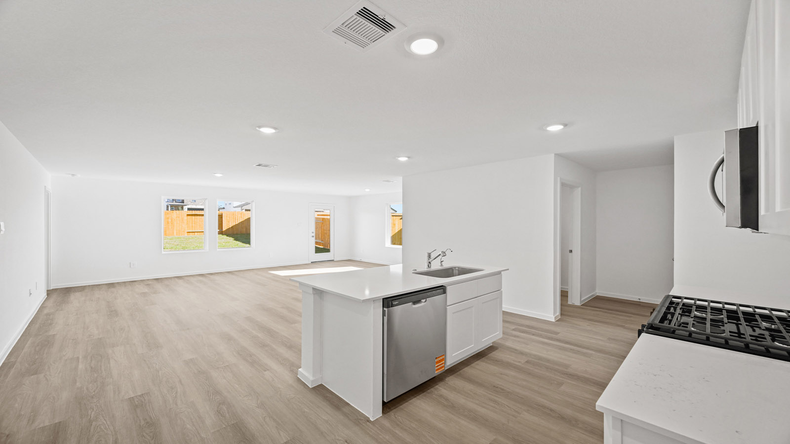 Open concept living, dining, and kitchen area