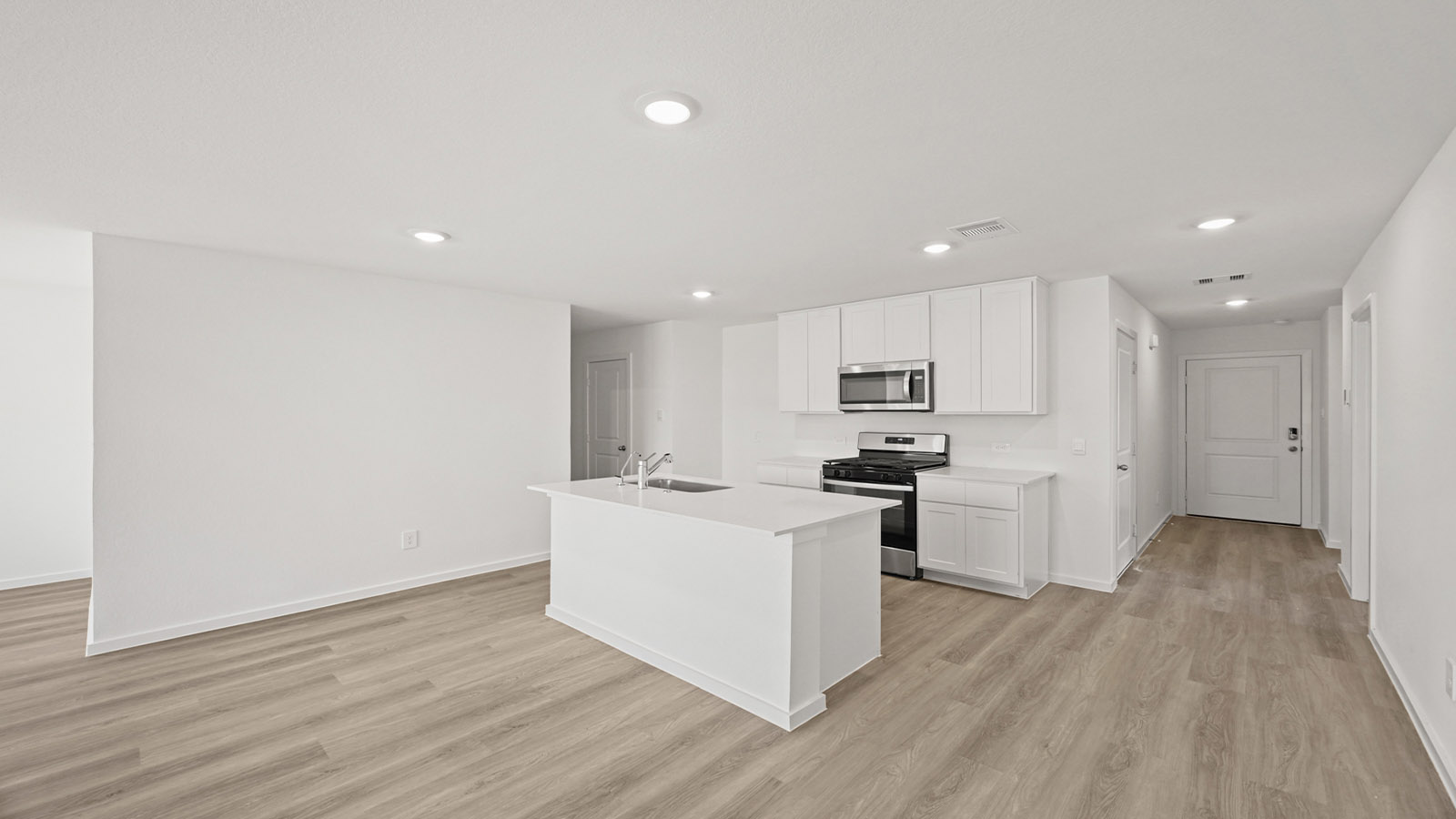 Open concept living, dining, and kitchen area