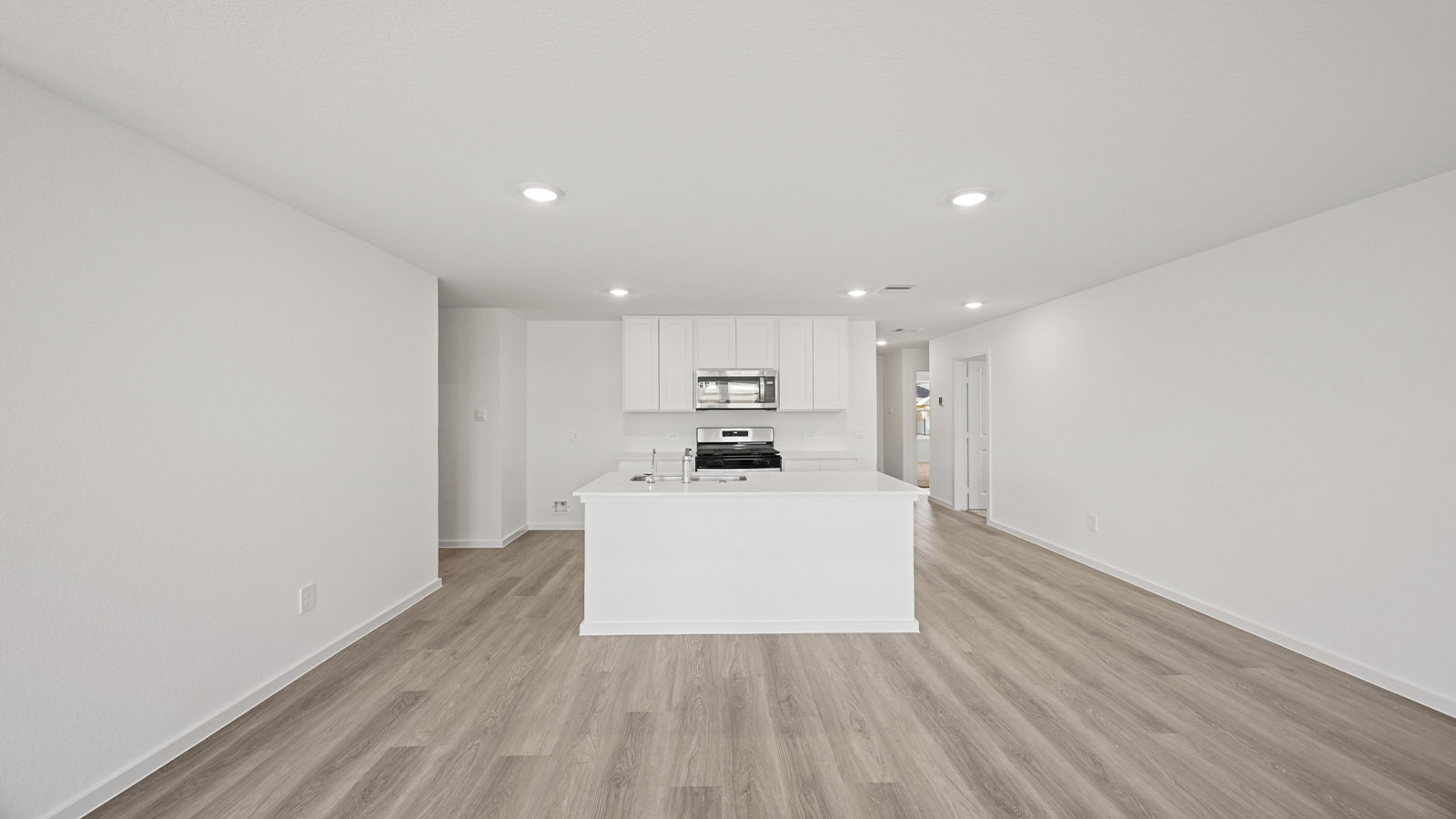 Open concept living, dining, and kitchen area