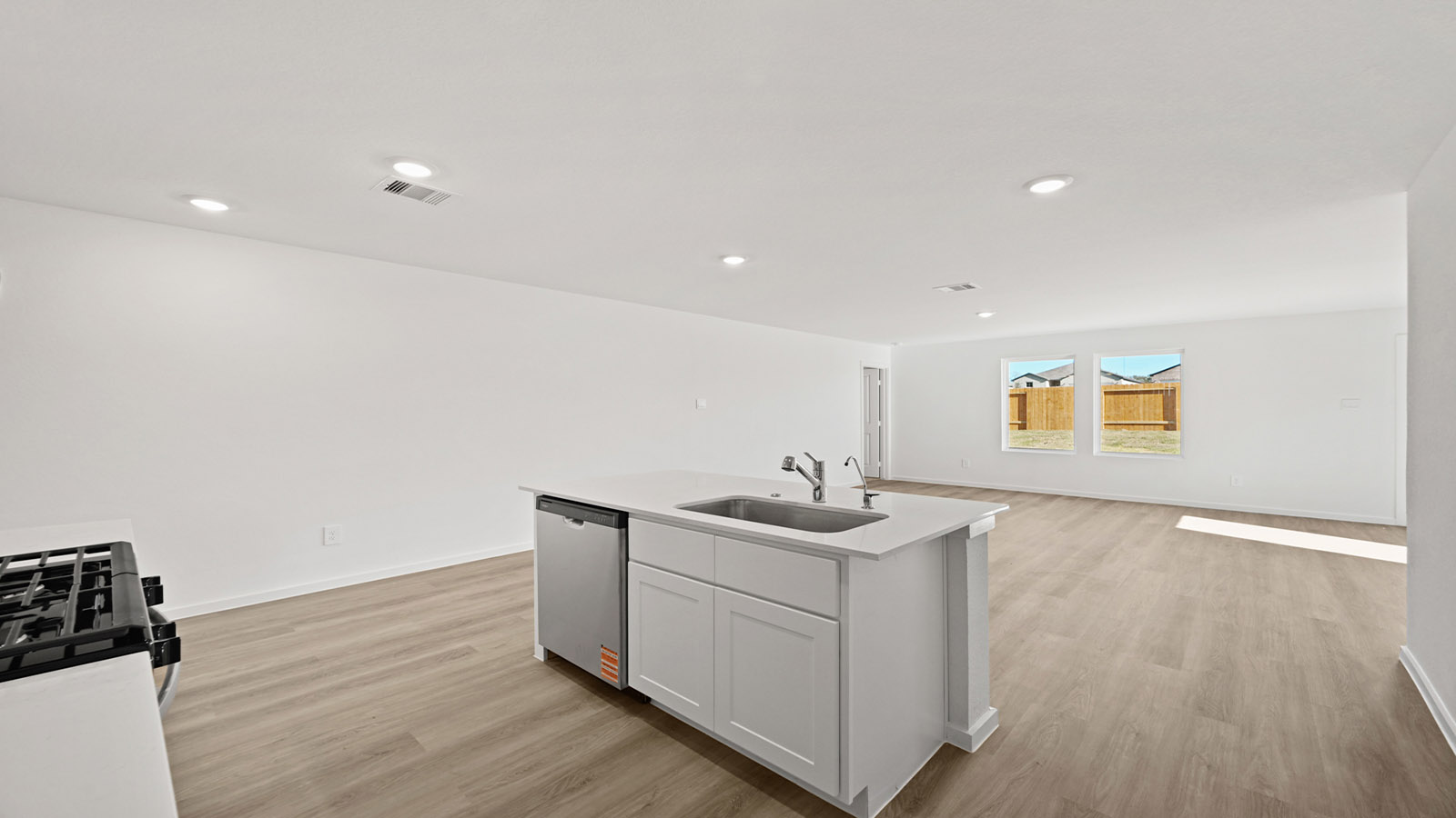 Open concept living, dining, and kitchen area