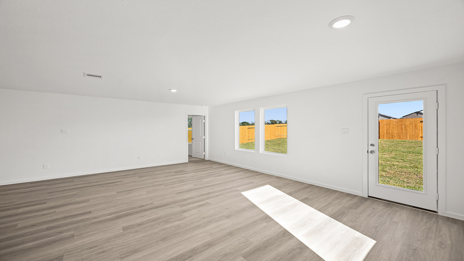 Open concept living, dining, and kitchen area