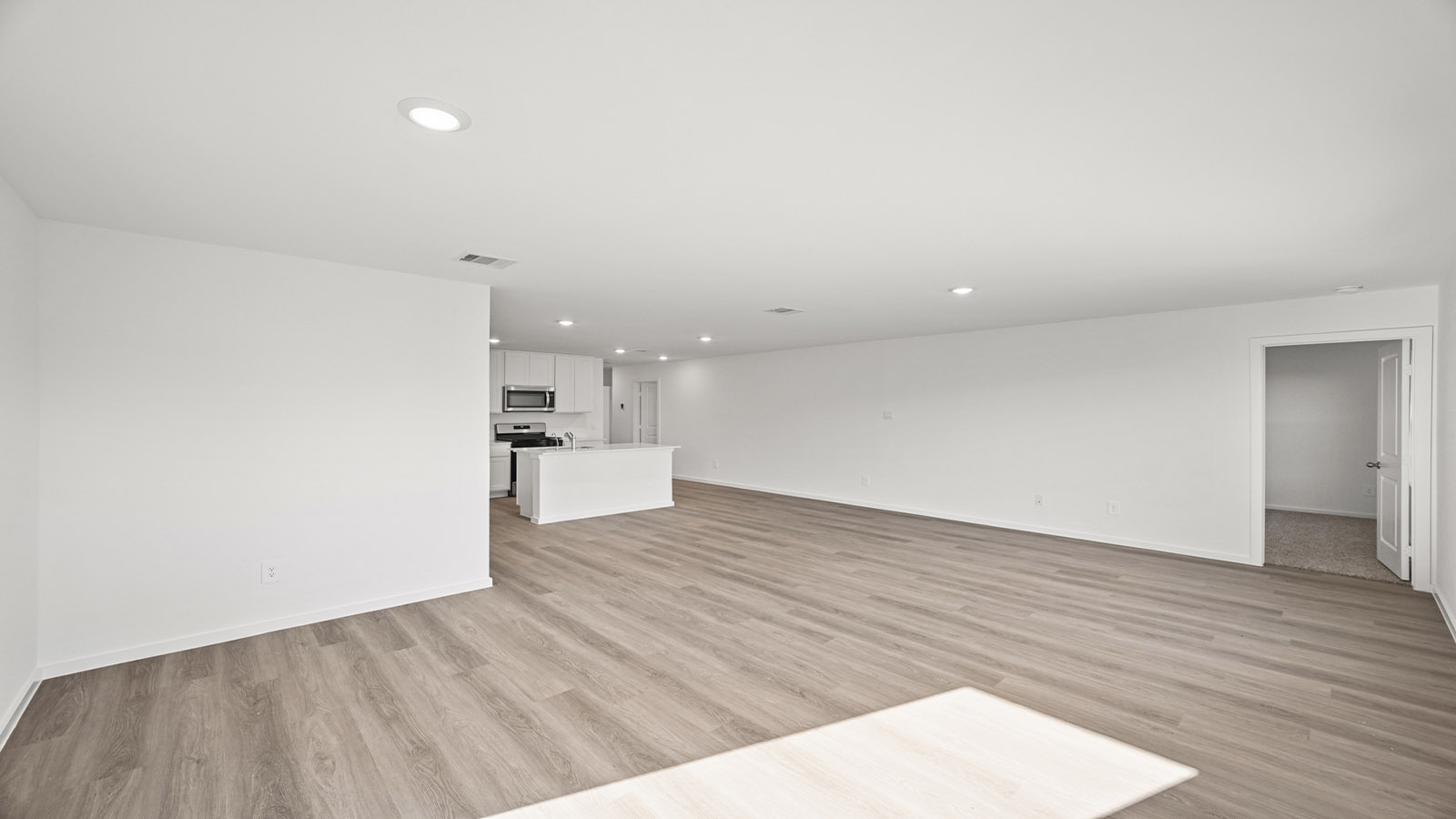 Open concept living, dining, and kitchen area
