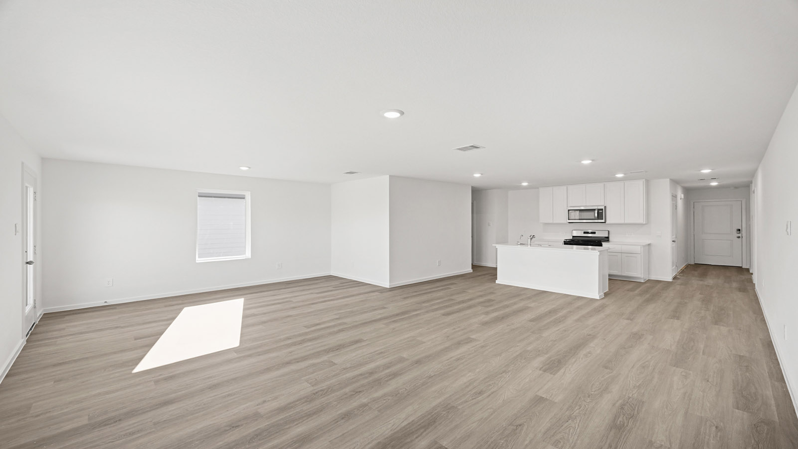 Open concept living, dining, and kitchen area