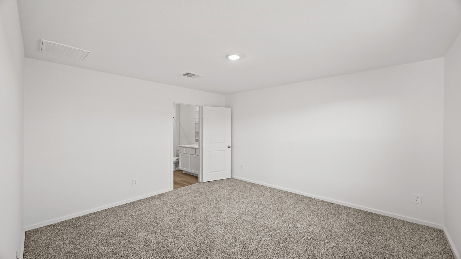 Primary bedroom with bright windows