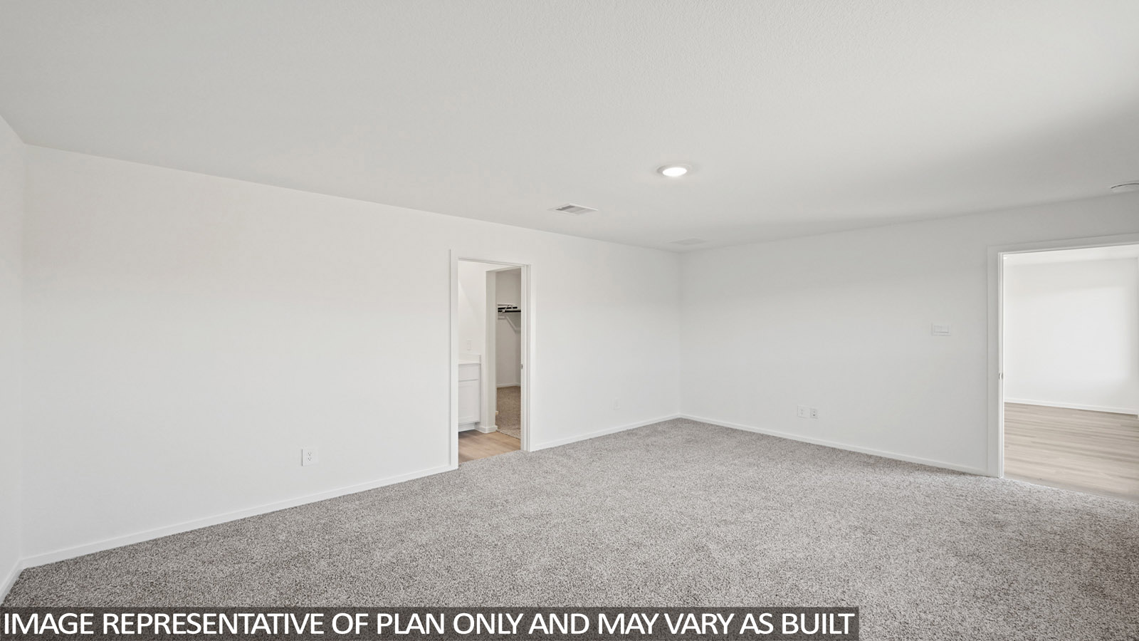 Primary bedroom with carpet flooring
