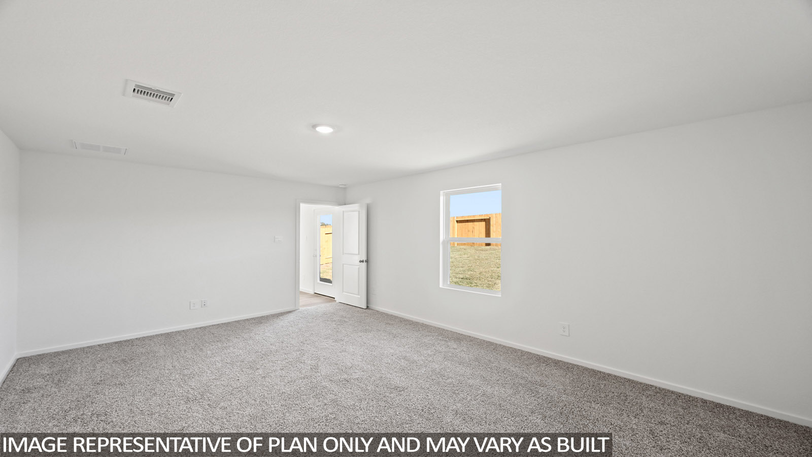 Primary bedroom with carpet flooring