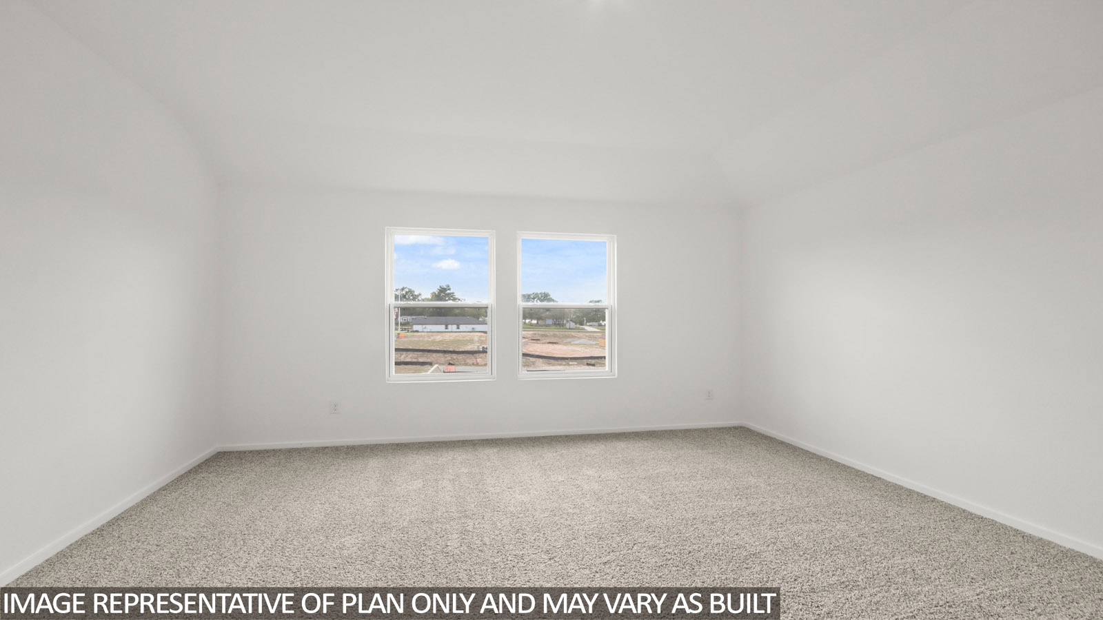 Primary bedroom with carpet flooring