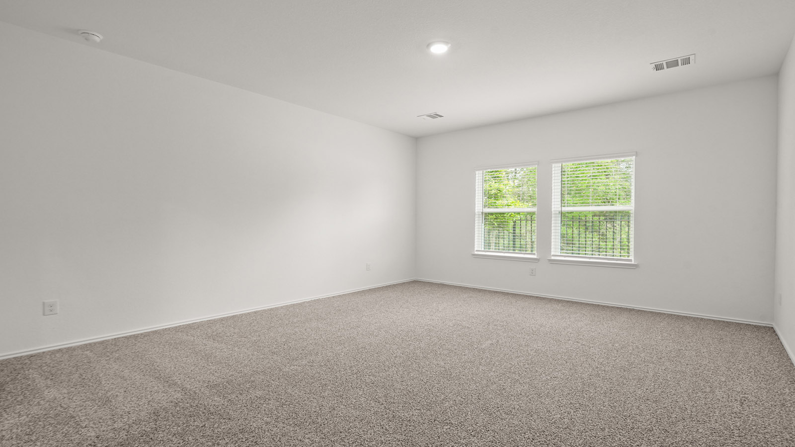 Primary bedroom with carpet flooring