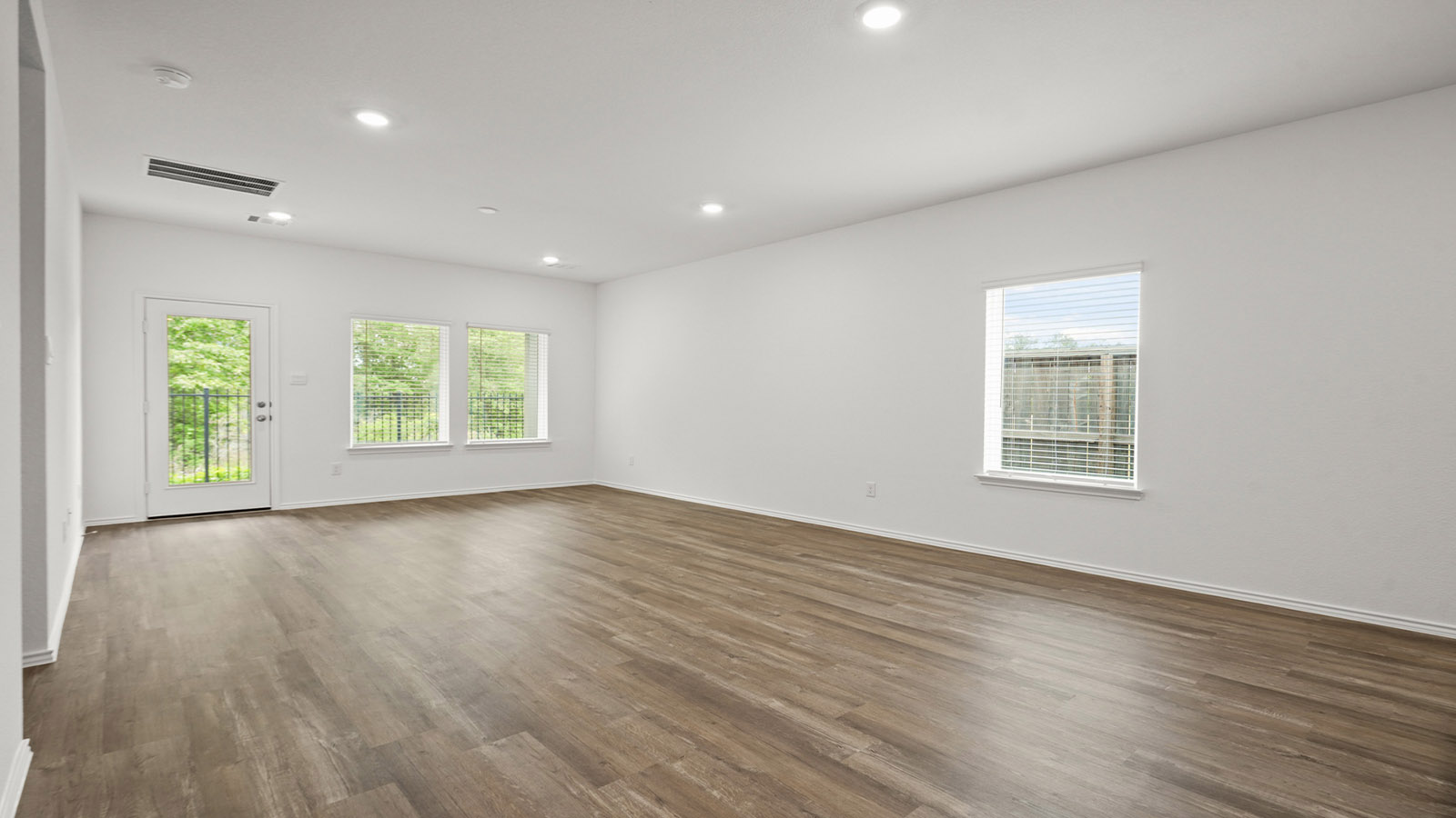 Open concept living, dining, and kitchen area