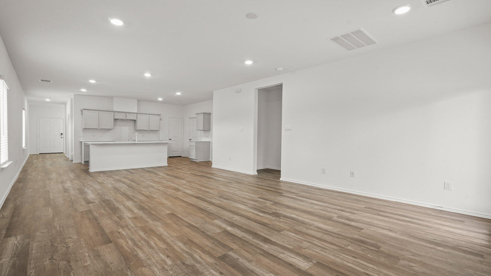 Open concept living, dining, and kitchen area