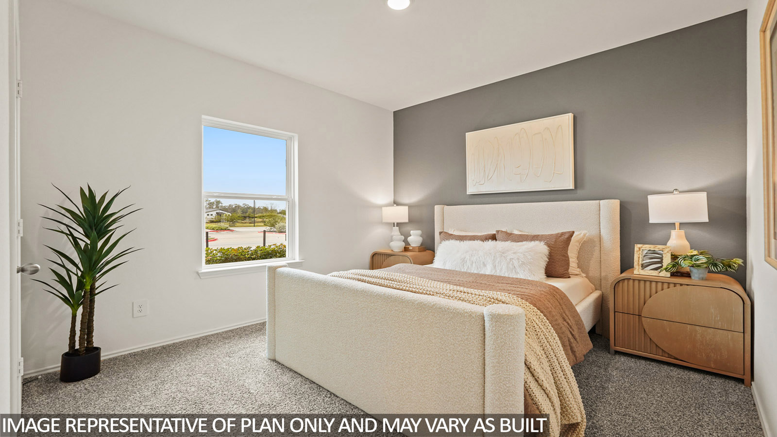 Secondary bedroom with carpet flooring