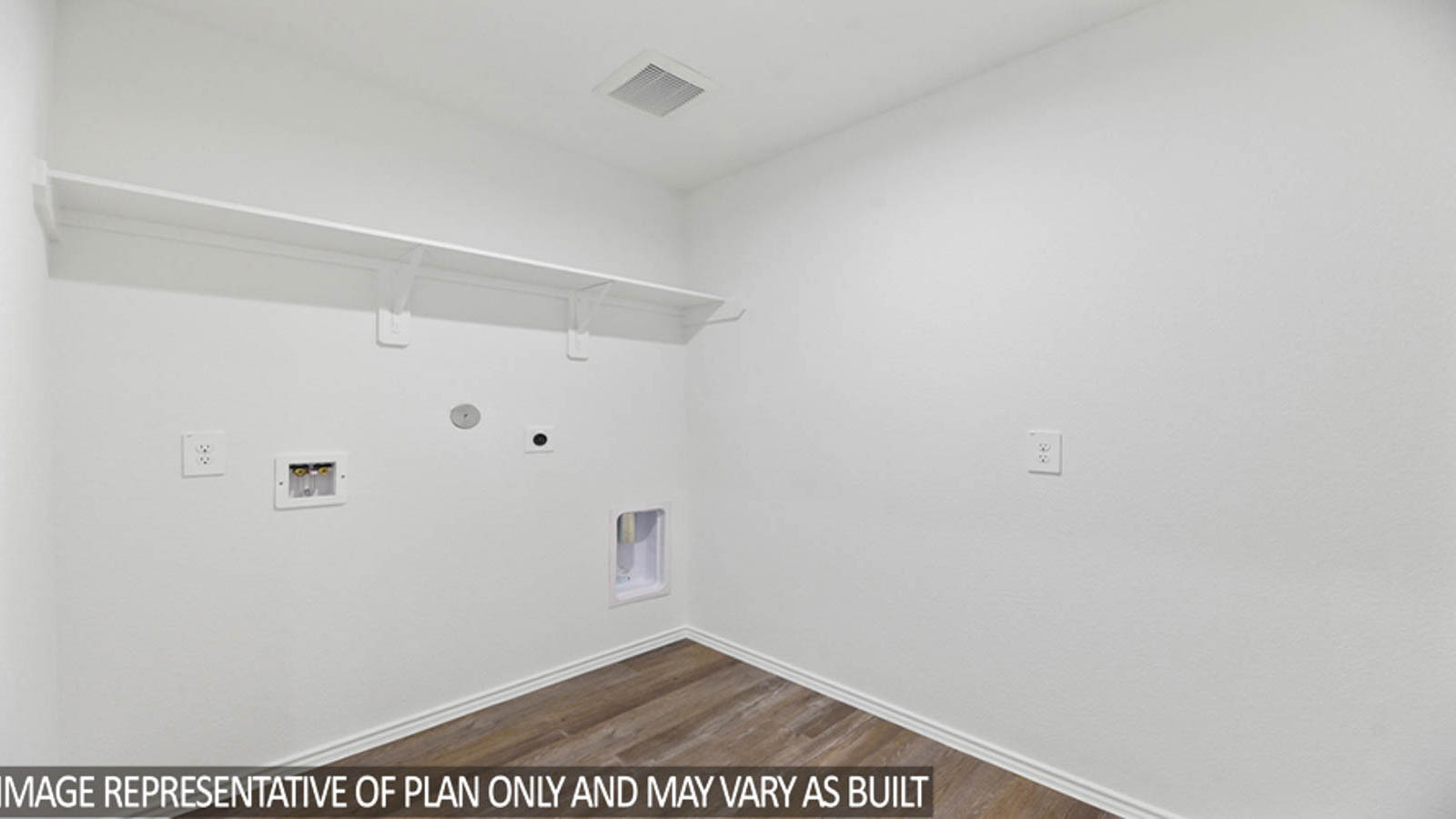 Utility room with vinyl flooring.