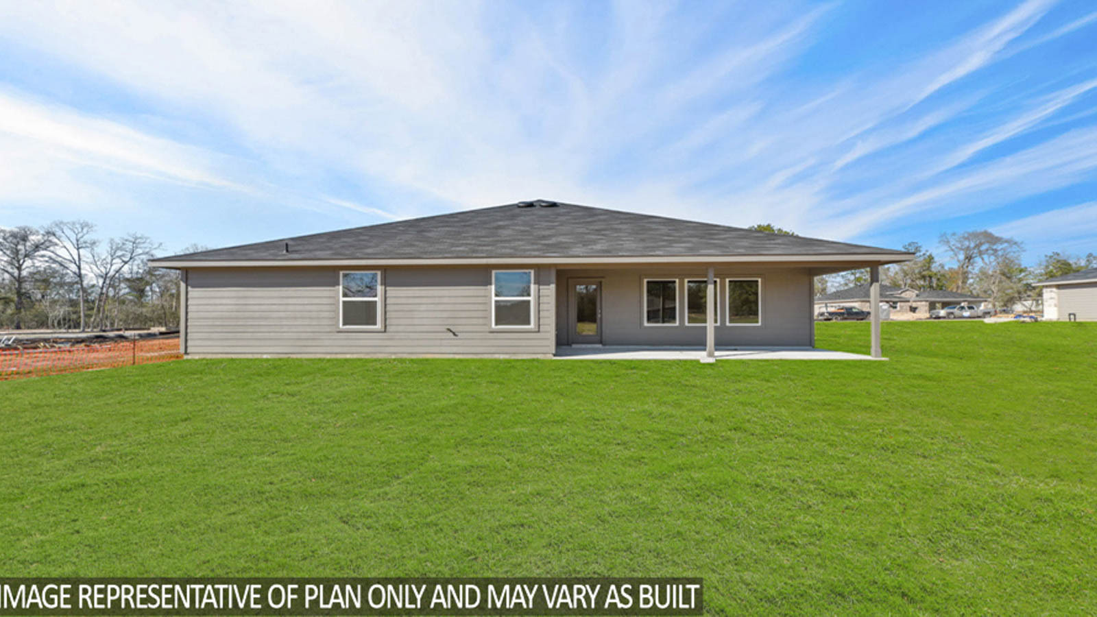 Spacious backyard with back patio and overhead lights.