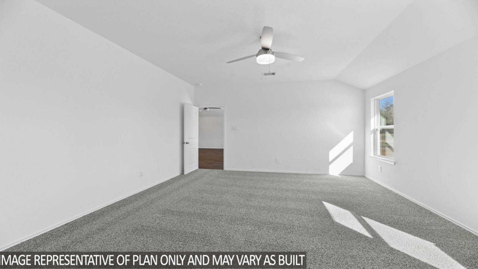 Primary bedroom with carpet flooring, a ceiling fan, and bright windows.