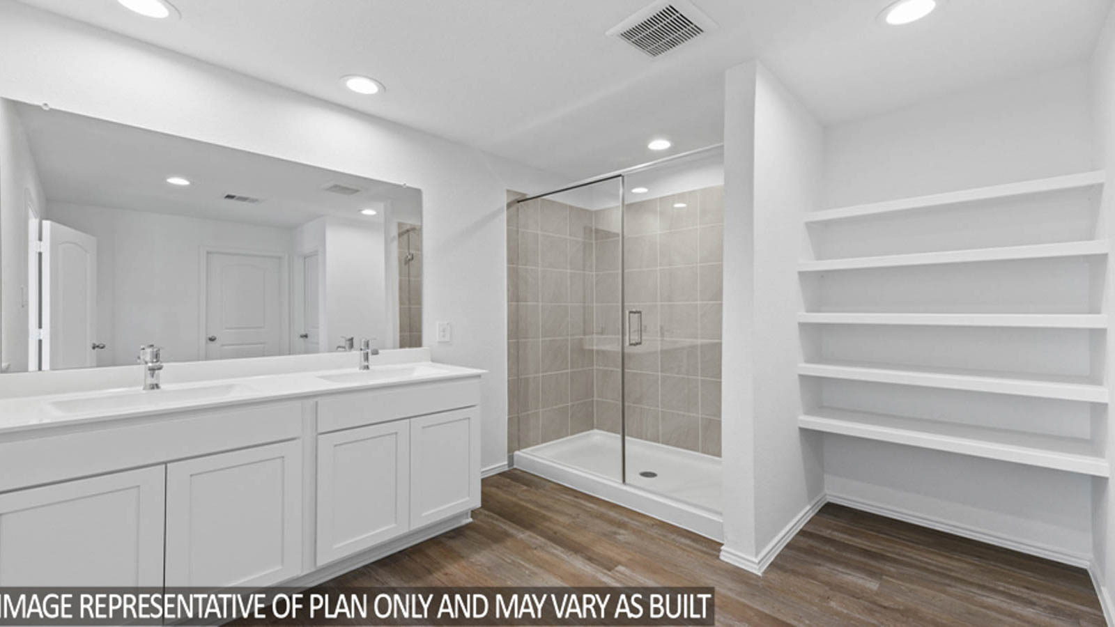 Primary bathroom with linen nook and a standing shower with a glass door.