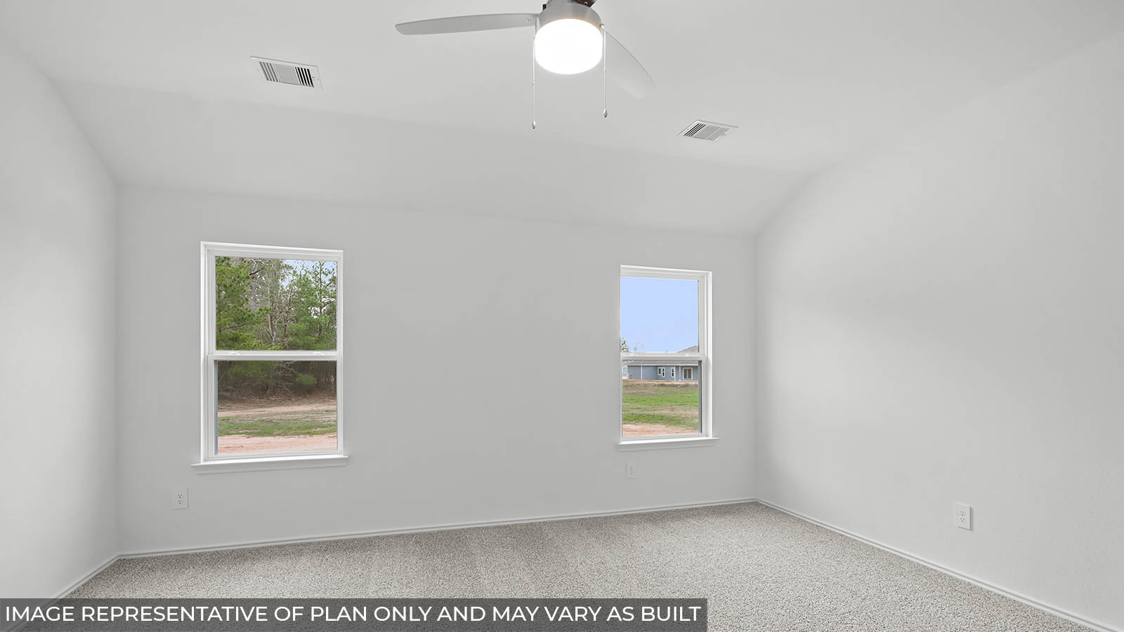 Primary bedroom with carpet flooring