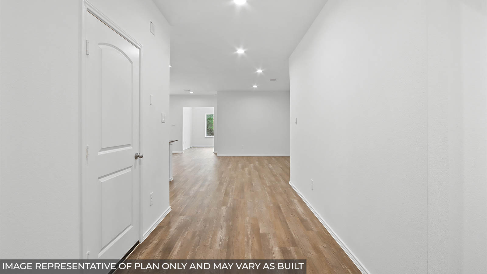 Entryway and foyer with vinyl flooring.