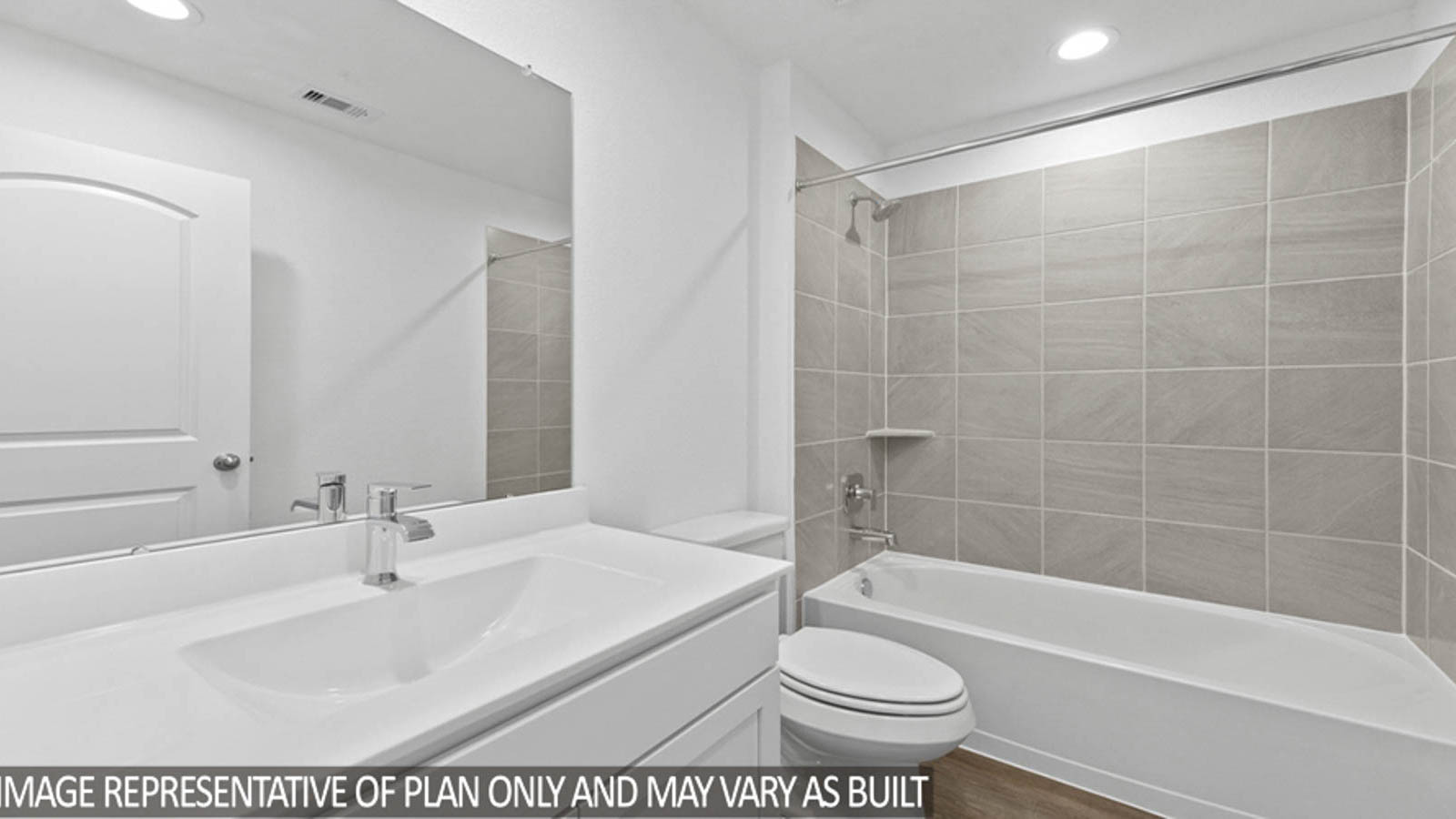 Secondary bathroom with a tile tub/shower combo.