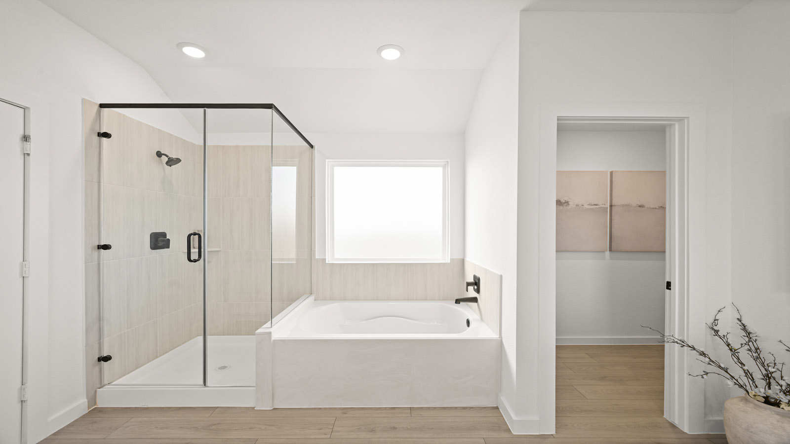 primary bathroom with tub and shower