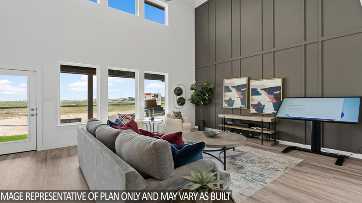 Spacious living area with vinyl flooring
