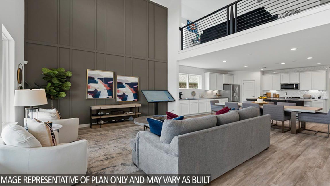 Spacious living area with vinyl flooring
