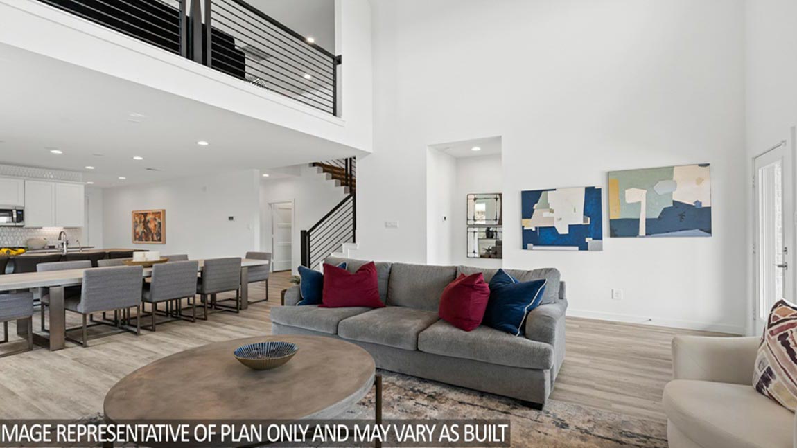 Spacious living area with vinyl flooring