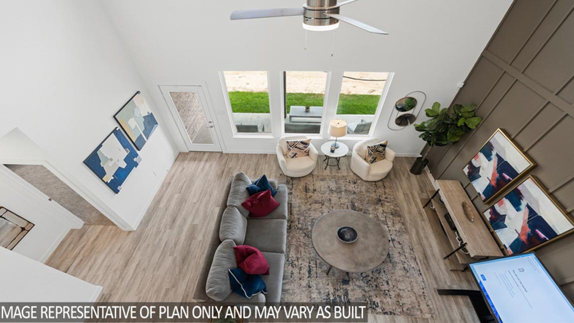 Spacious living area with vinyl flooring