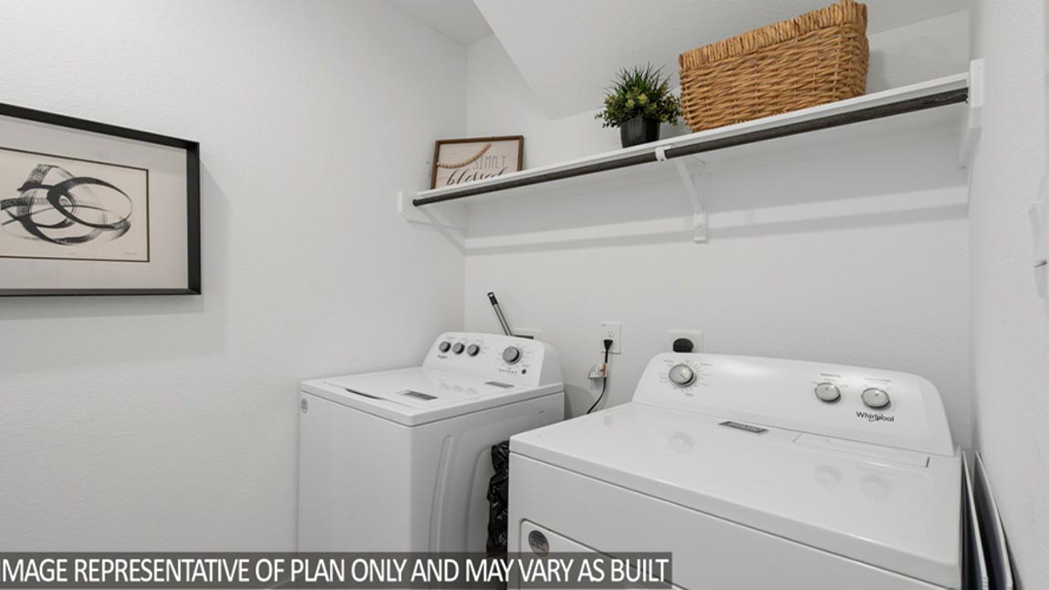 utility room with vinyl flooring