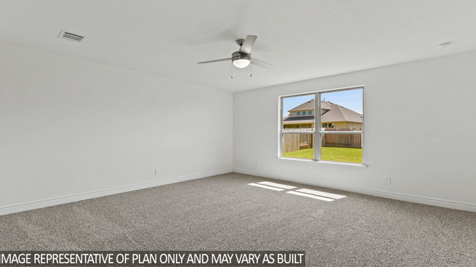 Primary bedroom with carpet flooring