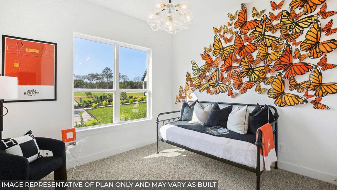 Secondary bedroom with carpet flooring