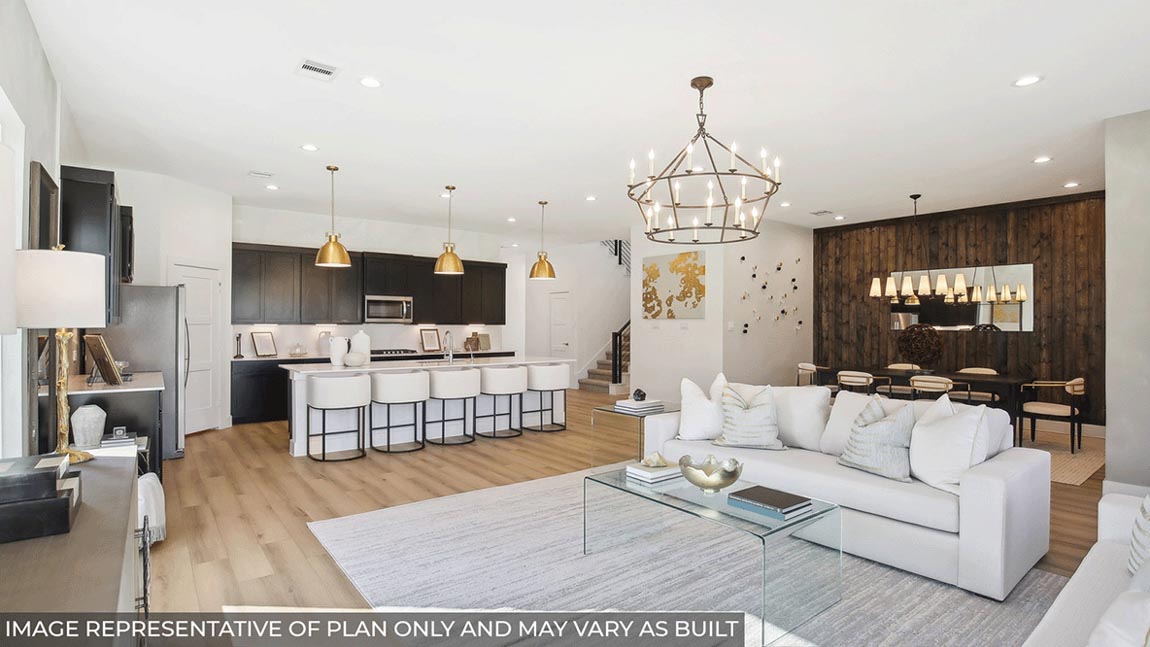 Spacious living area with vinyl flooring