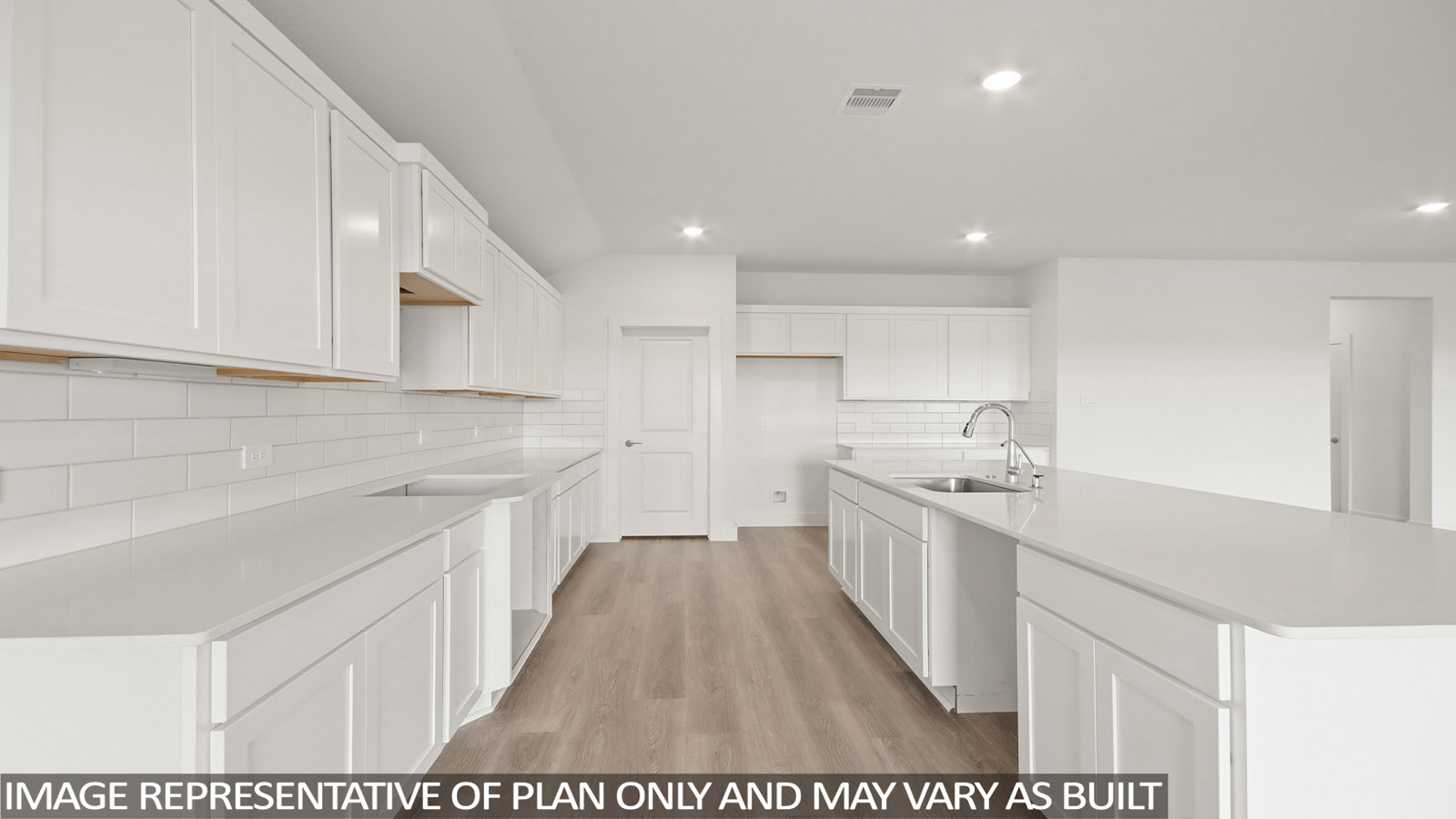 Kitchen with an island and vinyl floor
