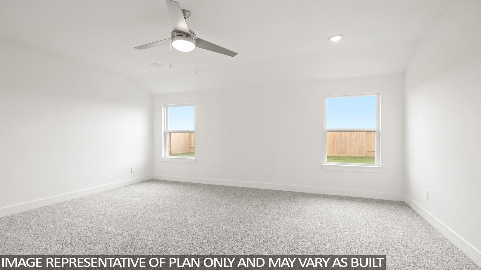 Primary bedroom with bright windows
