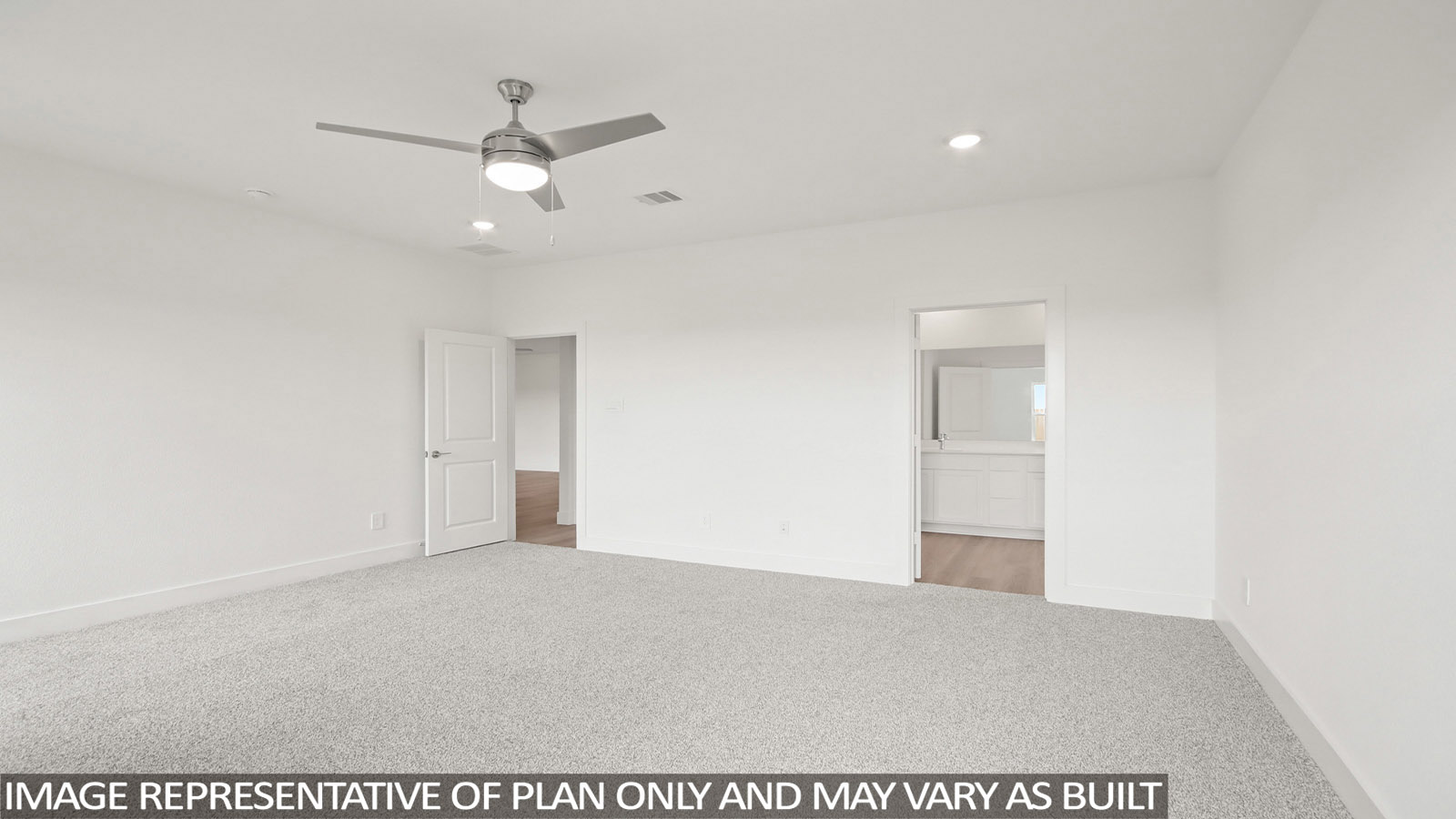 Primary bedroom with carpet flooring