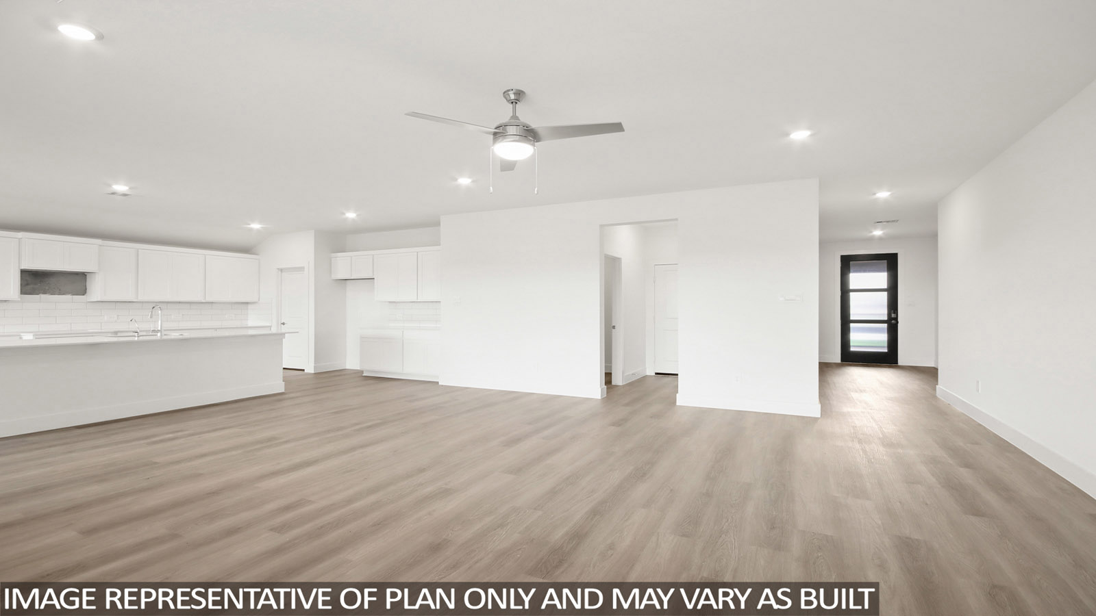 Spacious living area with vinyl flooring