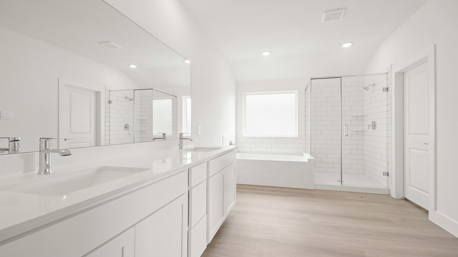 Primary bathroom with tub and shower