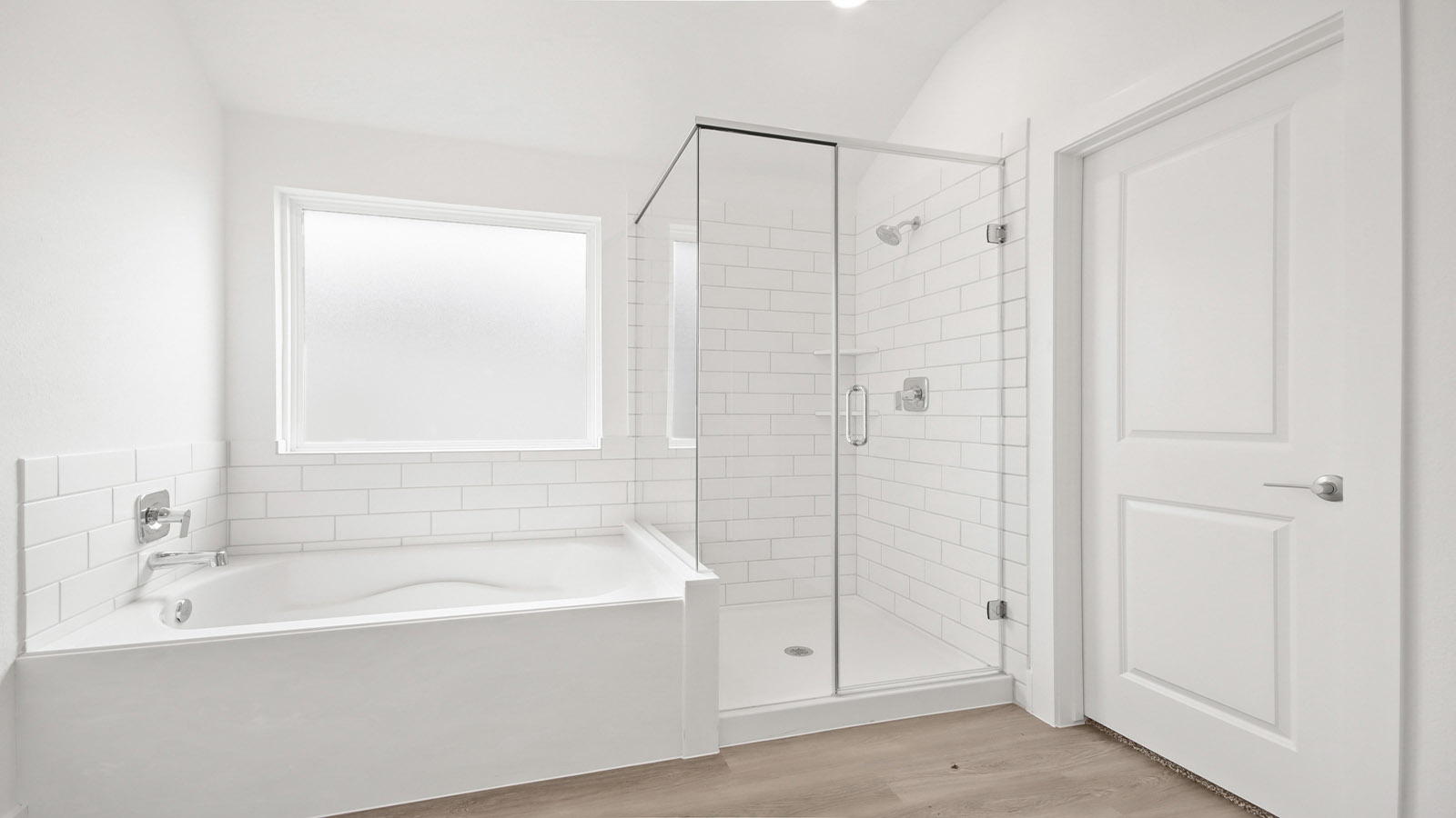 Primary bathroom with tub and shower