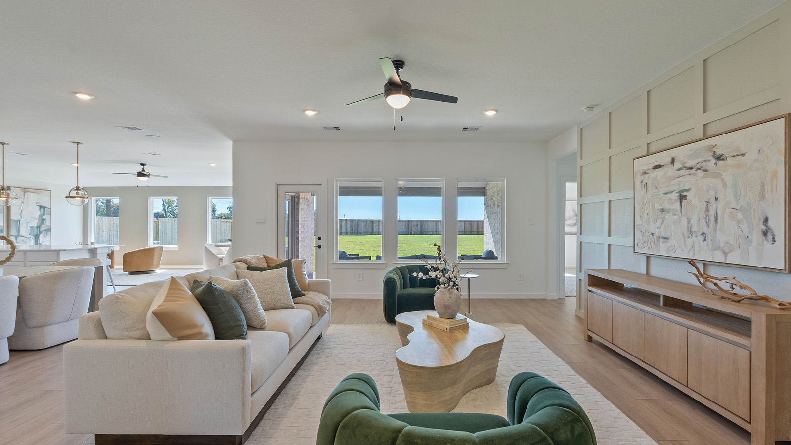 Spacious living area with vinyl flooring
