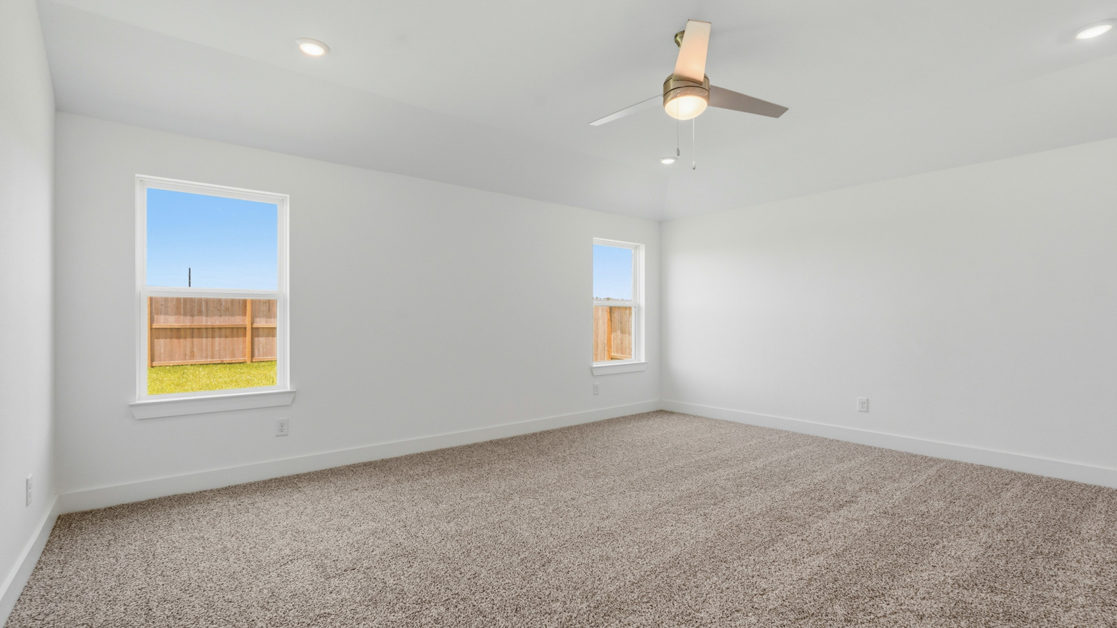 Primary bedroom with carpet flooring