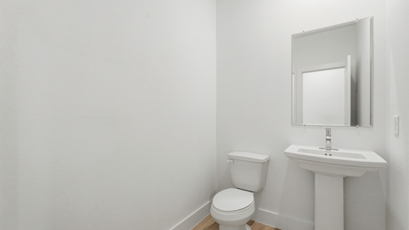 Powder bathroom with pedestal sink