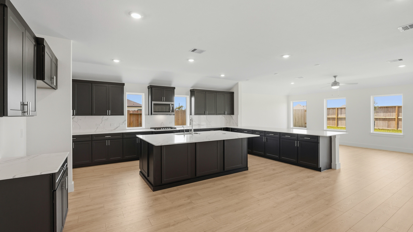 Kitchen with an island and vinyl floor