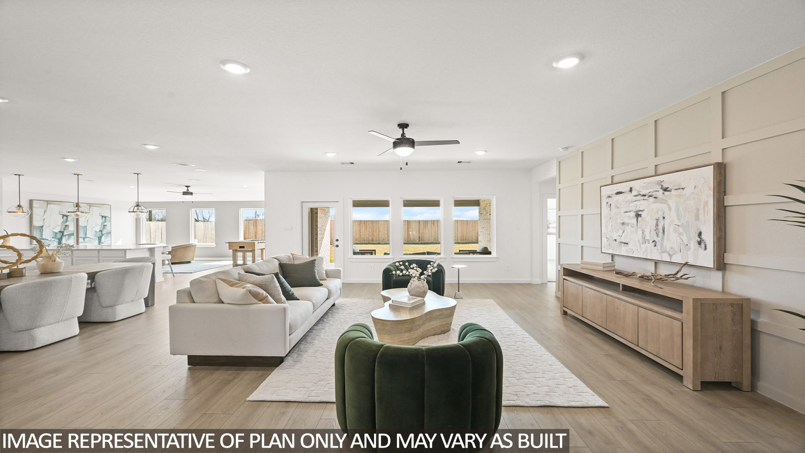 Spacious living area with vinyl flooring