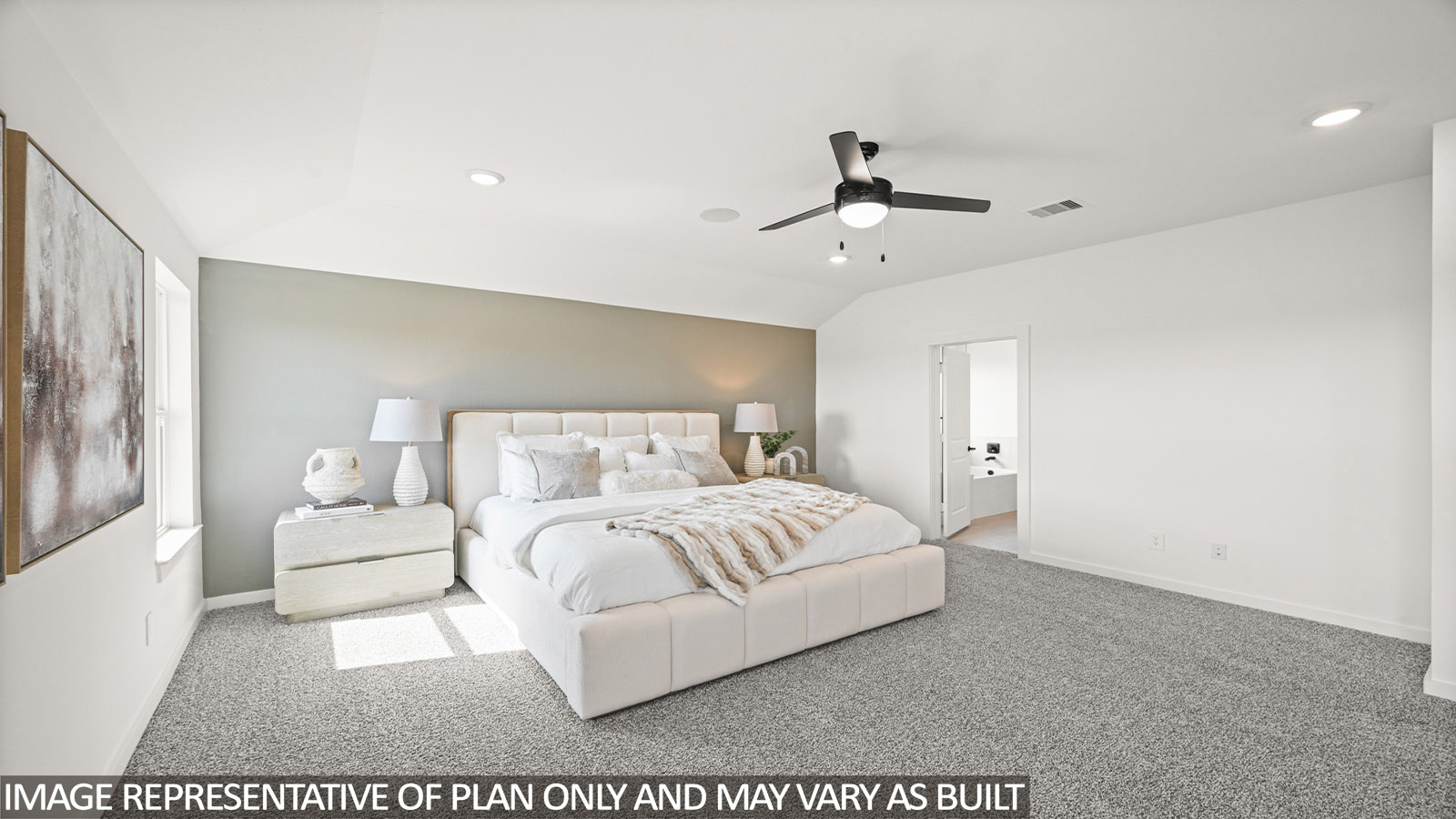 Primary bedroom with bright windows
