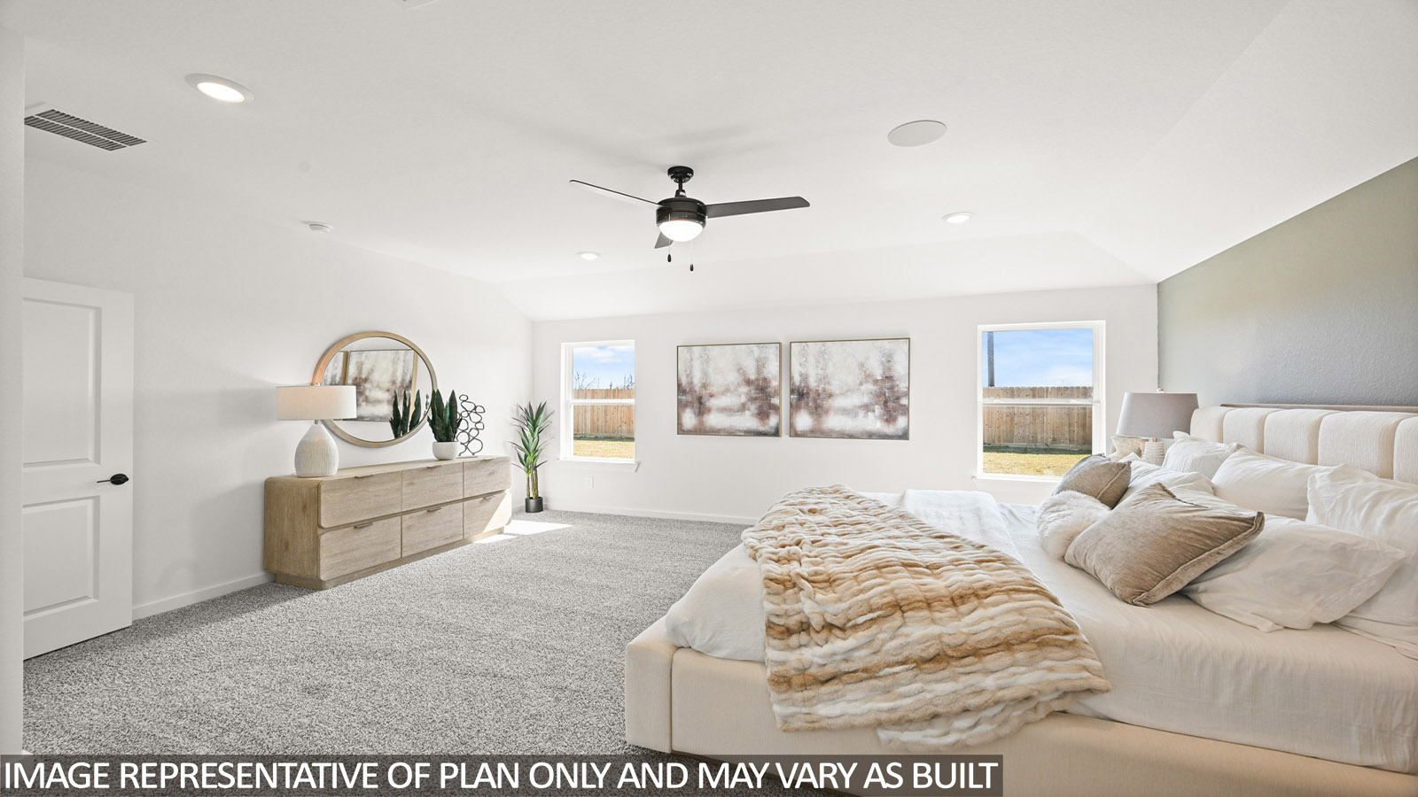 Primary bedroom with carpet flooring