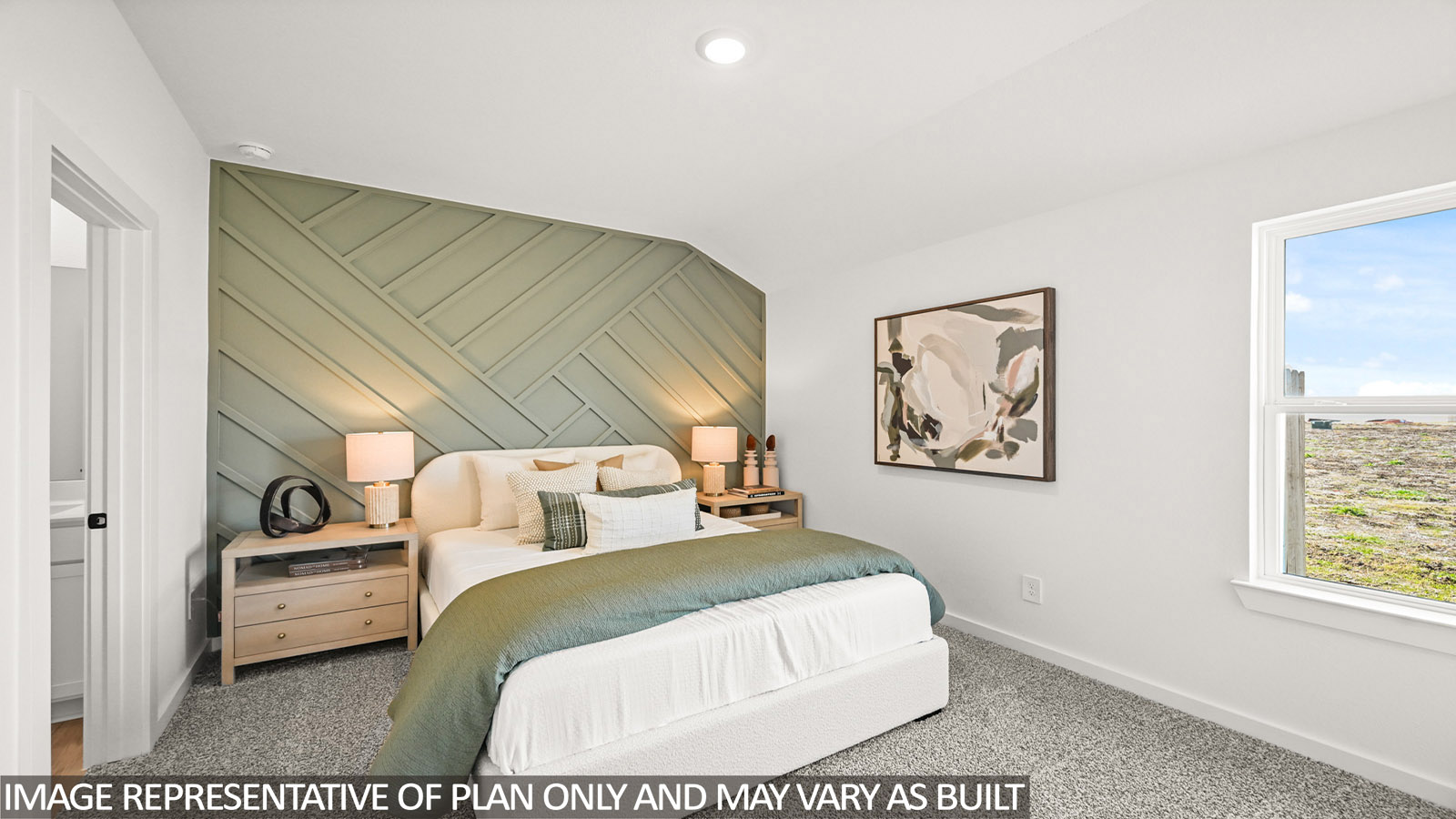Secondary bedroom with carpet flooring